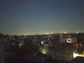 High angle view of illuminated buildings at night