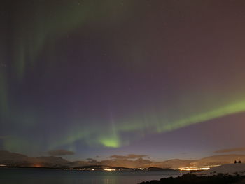 Scenic view of sea against sky at night