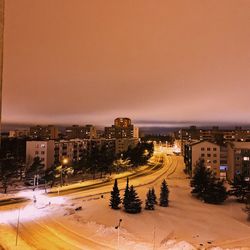 High angle view of illuminated city buildings during winter