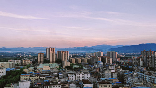 High angle view of buildings in city against sky