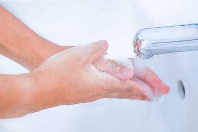 Close-up of hand holding water