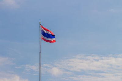 Low angle view of flag against sky