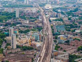 Aerial view of railroad tracks passing through city