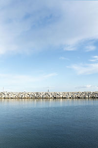 Bridge over sea against sky