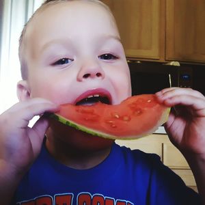 Close-up portrait of girl eating food