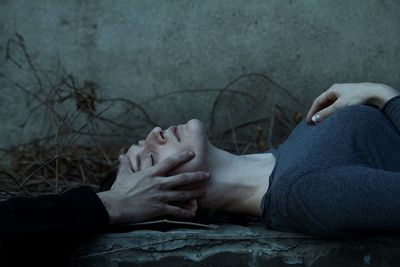 Midsection of woman resting on floor