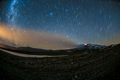 Scenic view of mountains at night