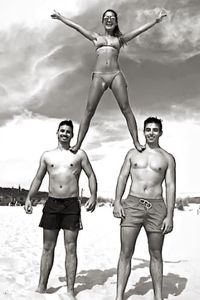 Full length of shirtless man standing on beach