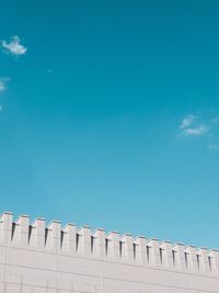 Low angle view of building against blue sky