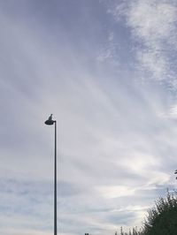 Low angle view of floodlight against sky