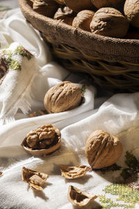 Whole walnuts in basket, food harvest, rustic style