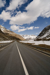 Empty road against sky