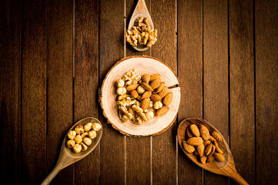 Nuts and almonds on a wooden table 