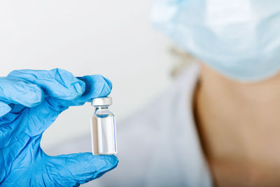 Close-up of man holding bottle