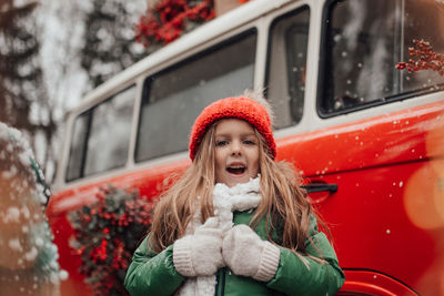 Portrait of young woman in car