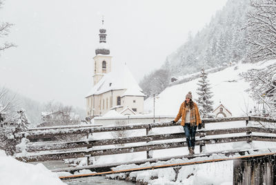 Man walking on snow covered mountain