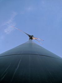 Low angle view of wind turbine against clear sky