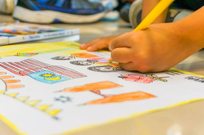 Close-up of hands playing on table