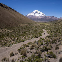 Scenic view of snowcapped mountains against blue sky