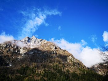 Low angle view of rock formation against sky