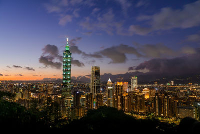 Illuminated buildings in city at night