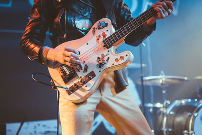 Low angle view of man playing guitar