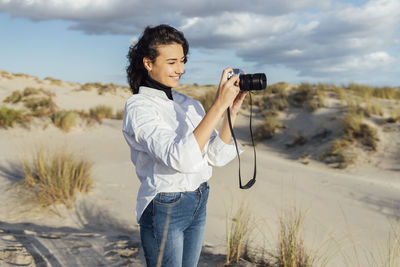 Young man photographing