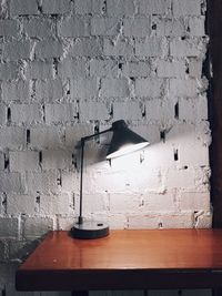 Close-up of electric lamp on wall