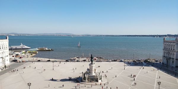 High angle view of harbor by sea against clear sky