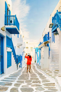 Rear view of woman walking on street