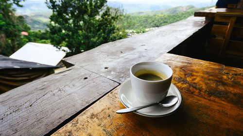 High angle view of coffee on table in balcony