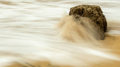 High angle view of water flowing through rocks