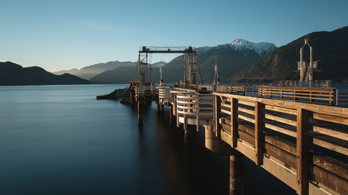 Pier over lake against sky