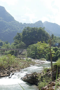 Scenic view of river flowing through rocks