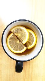 Directly above shot of lemon in plate on table