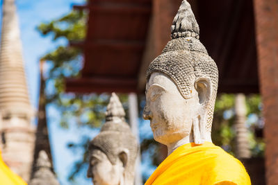 Statue of buddha against building