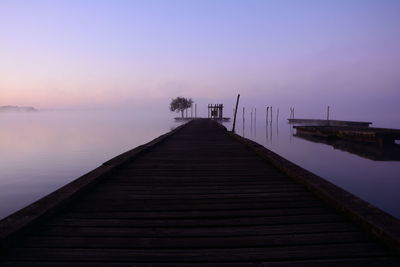 Pier over lake against sky