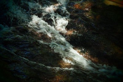 Close-up of water flowing over river
