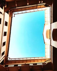 Low angle view of building against clear blue sky