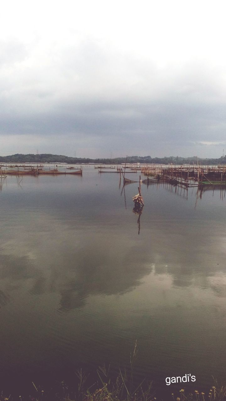 water, sky, nature, reflection, shore, morning, lake, tranquility, cloud, reservoir, beauty in nature, wetland, scenics - nature, day, tranquil scene, outdoors, animal, environment, animal themes, horizon, no people, marsh, coast, landscape, architecture, travel destinations, body of water, land, bird, non-urban scene