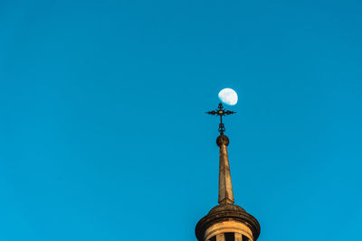 Low angle view of street light against building