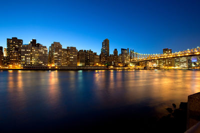 Illuminated city at waterfront