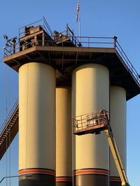 Low angle view of factory against sky