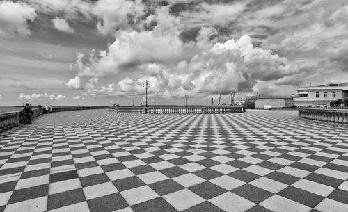 Panoramic view of building by sea against sky