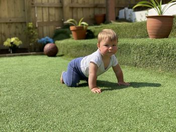 Full length of boy playing on field