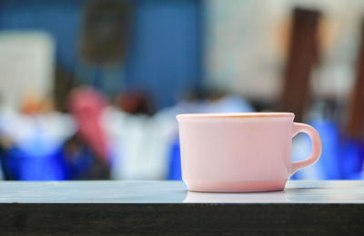 Close-up of coffee cup on table