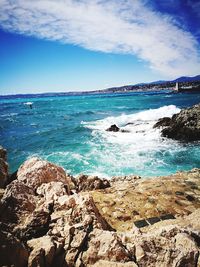 Scenic view of sea against blue sky