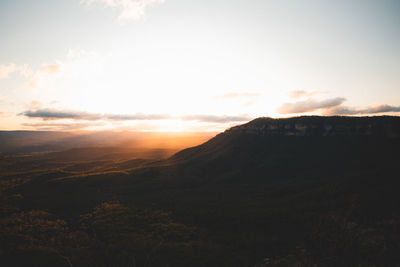Scenic view of mountains against sky during sunset