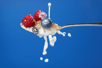 Close-up of ice cream against blue background