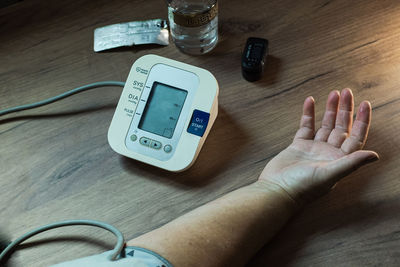 High angle view of human hand on table